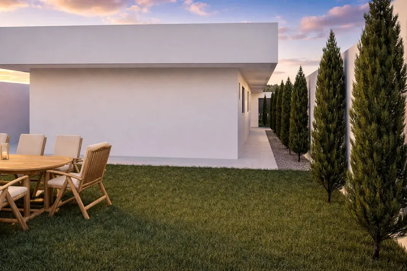 Área externa moderna com jardim e ciprestes